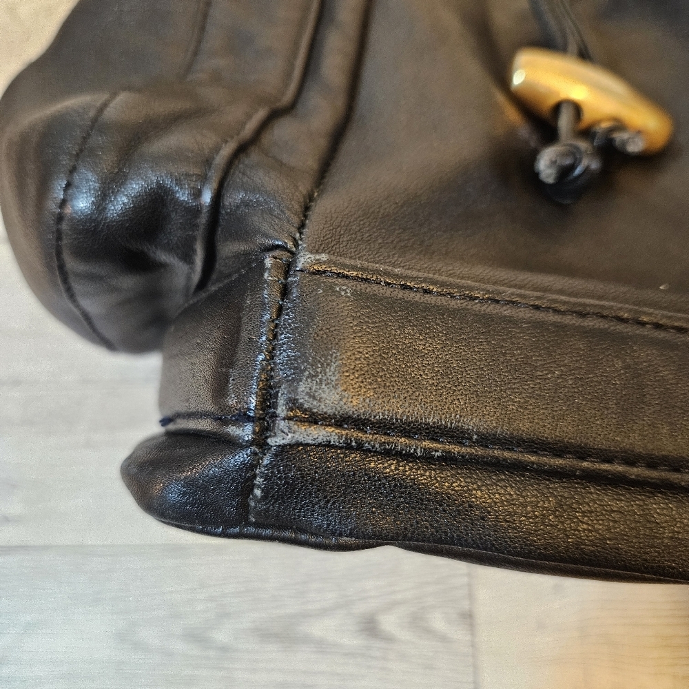 Sabina Black Leather Drawstring Shoulder Bag with Gold Accents - Picture 14 of 16